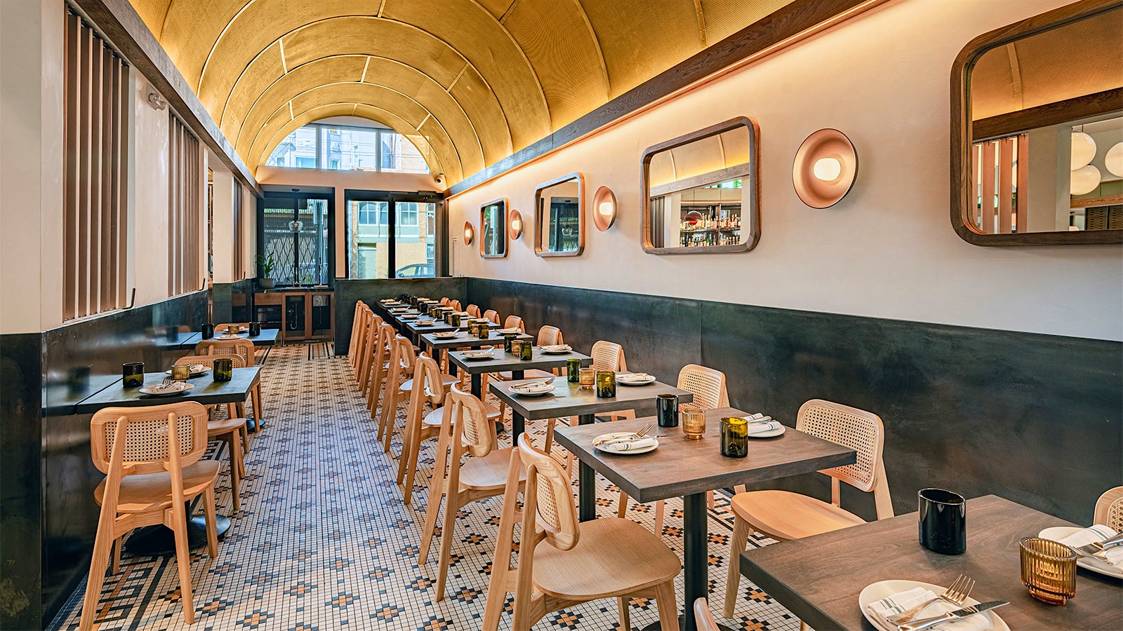  One of Delfina's revamped dining rooms, with a gold arched roof